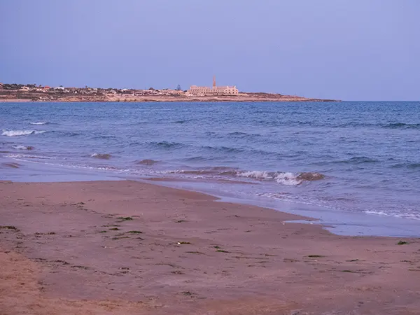 Sampieri-beach-and-historic-Penna-furnace-in-the-background